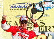 Joey Logano celebrates in Victory Lane at Kansas Speedway after earning his second win of 2010 and eighth win in the NASCAR Nationwide Series Kansas Lottery 300. Credit: Jason Smith/Getty Images for NASCAR